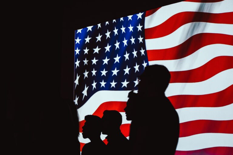 people in front of American flag