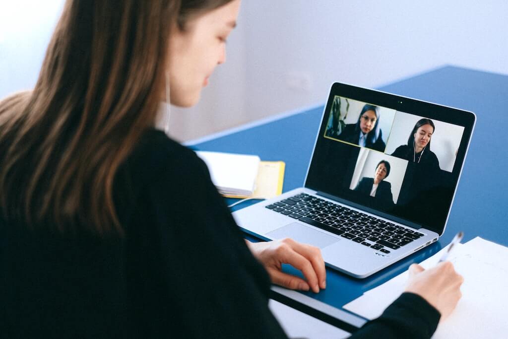 Professional team viewing Streamio-hosted video on laptop